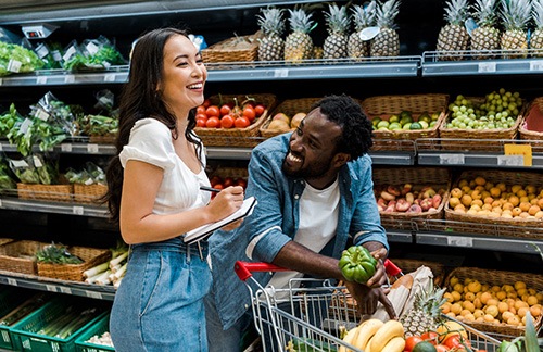 a couple going grocery shopping